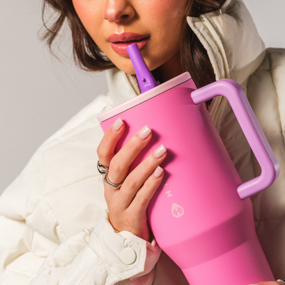 Person Drinking from HydroJug Pink Sugar Traveler 32oz