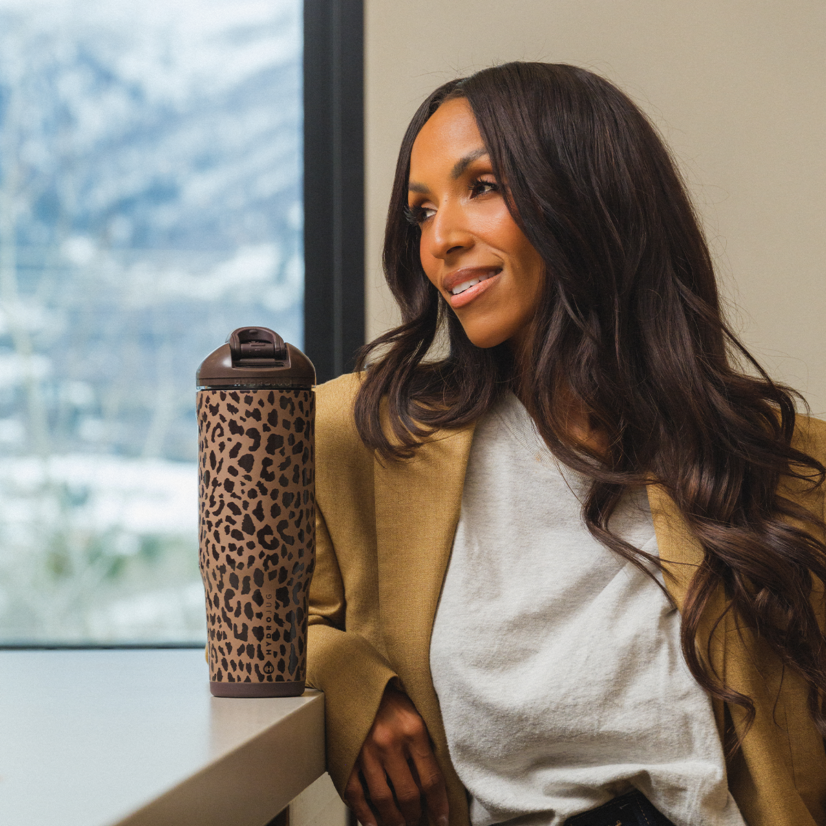 Woman Drinking from 32oz Brown Leopard HydroJug Ease2o