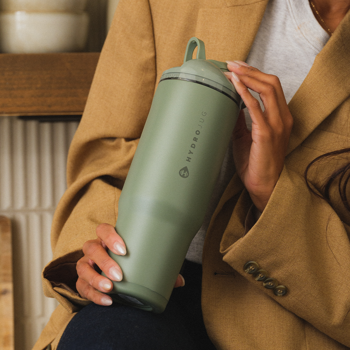Person Holding 40oz Courtyard HydroJug Ease2o