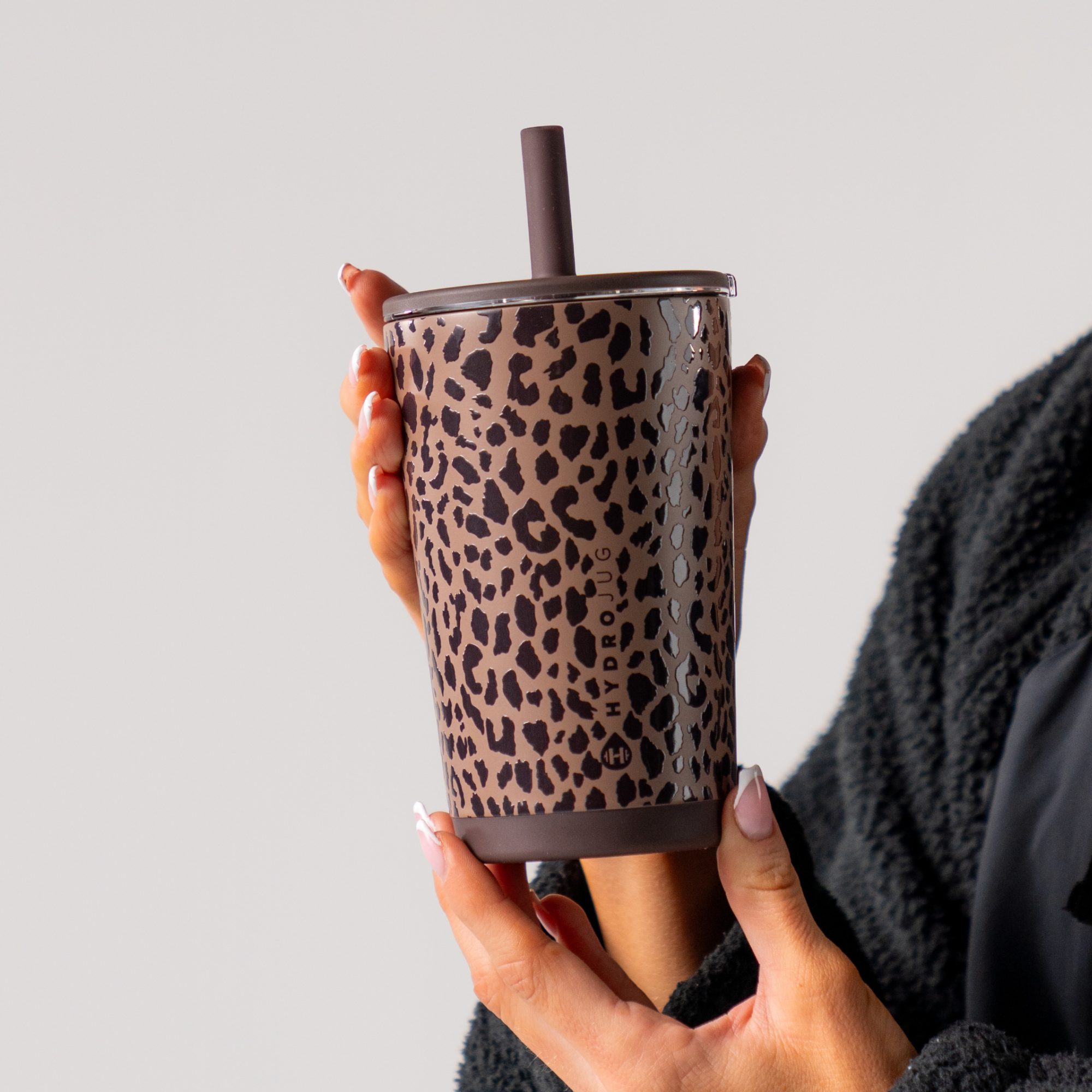 Hand Holding HydroJug Brown Leopard Everyday Tumbler 14oz