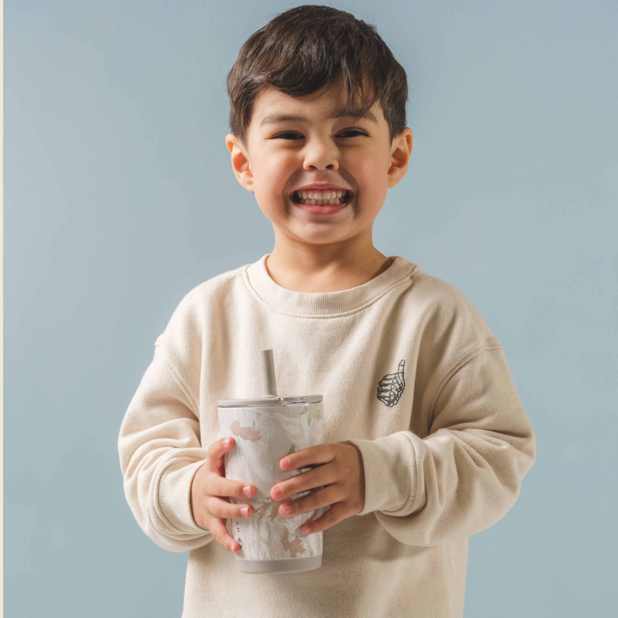 Kid Holding Camo Everyday Tumbler 14oz