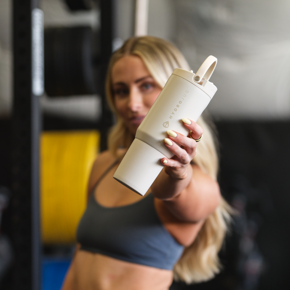 Person Holding HydroJug Cream Sport Bottle 20oz
