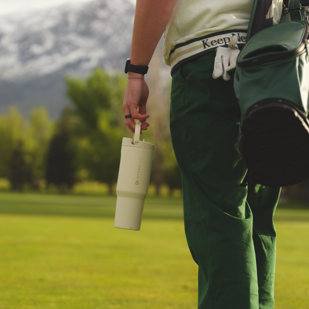 Person Holding HydroJug Cream Sport Bottle 40oz
