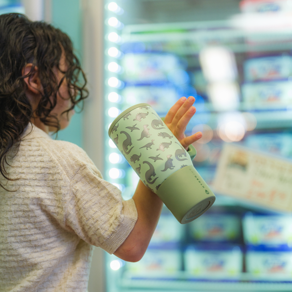 Kid Holding Dinosaur Traveler 20oz