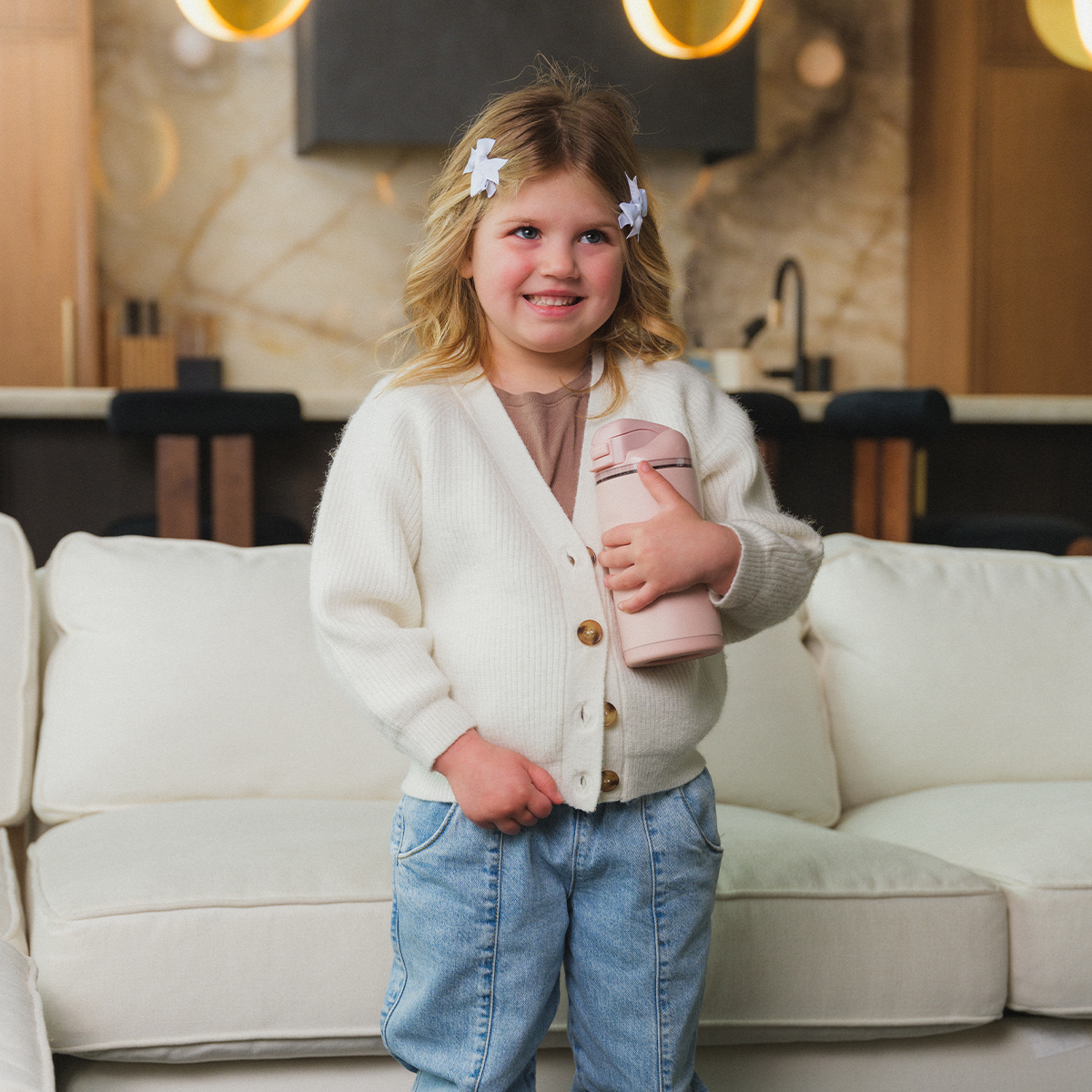 Girl Holding 14oz Dusty Rose HydroJug Ease2o
