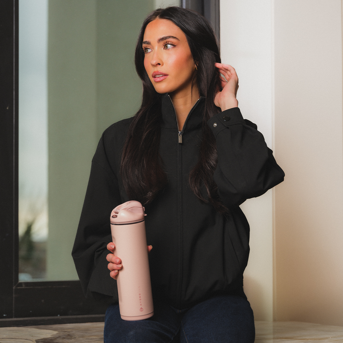 Woman Holding 24oz Dusty Rose HydroJug Ease2o