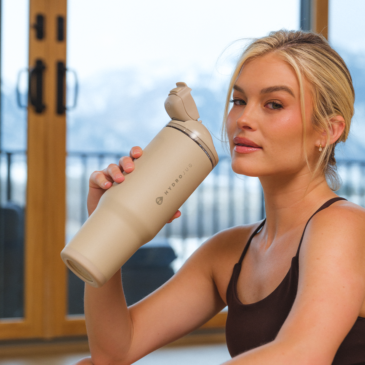 Woman Holding 32oz Dune HydroJug Ease2o